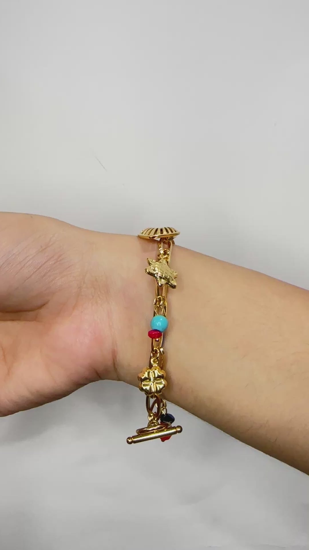 Golden Charm Bracelet with Playful Pendants